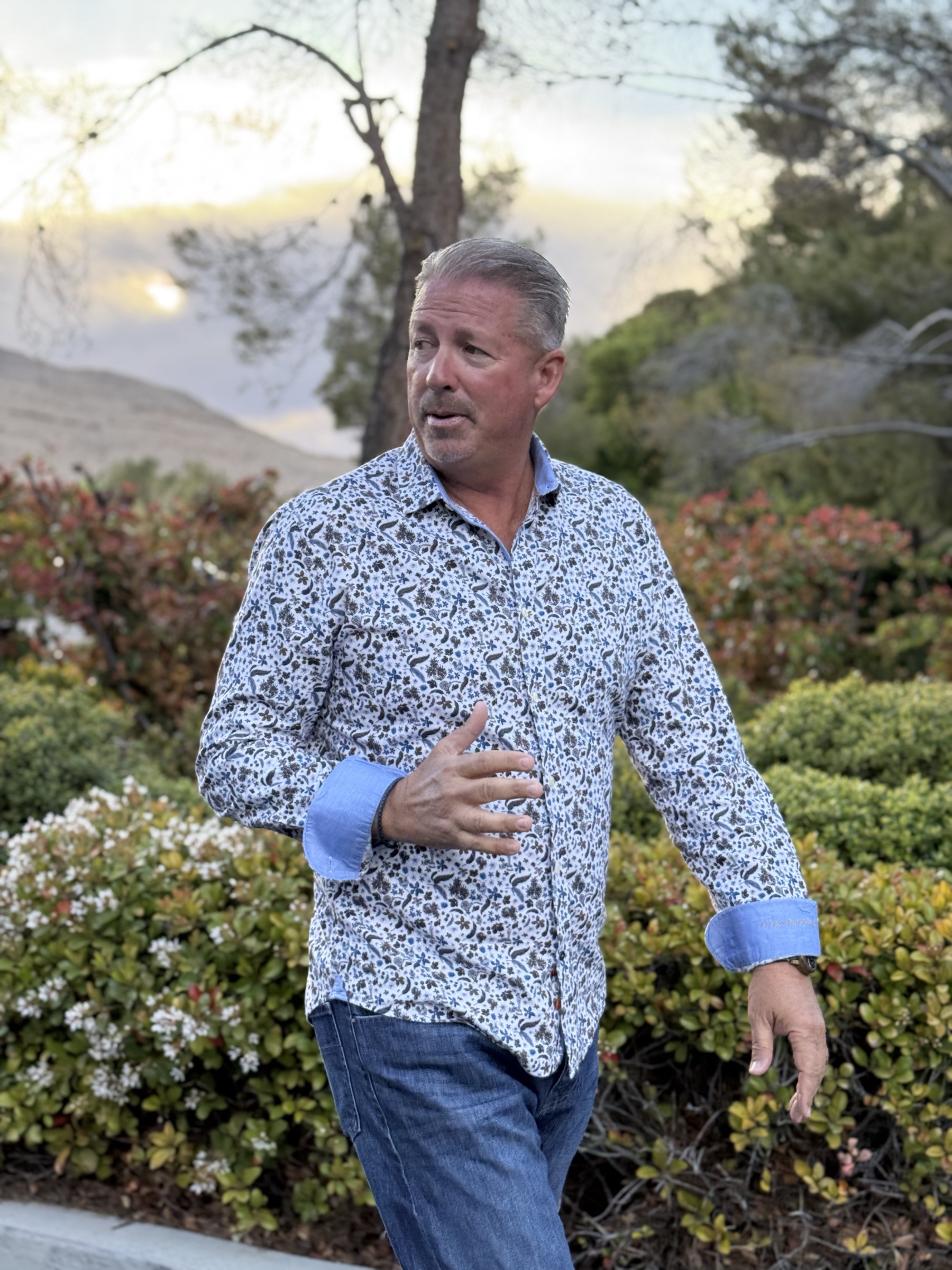 Steve de Laveaga speaking with partners outdoors